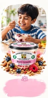 Boy enjoying Berry Granola yoghurt with family